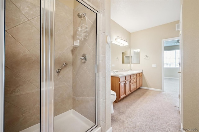 bathroom with vanity, toilet, and a shower with door