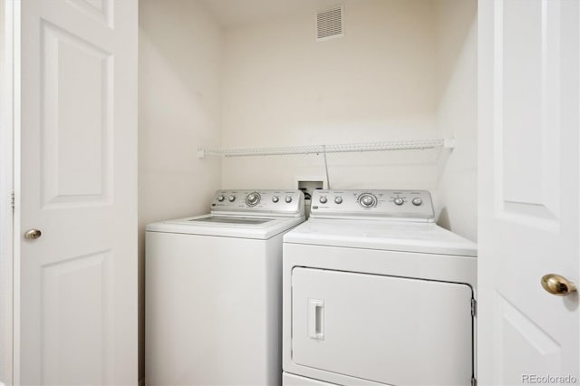 laundry room featuring independent washer and dryer