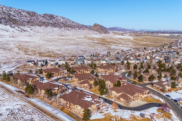 snowy aerial view featuring a mountain view