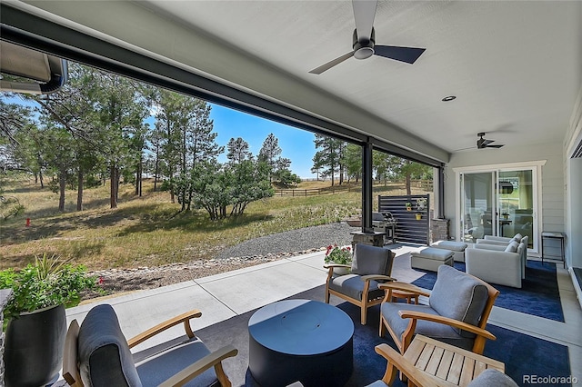 view of patio / terrace with ceiling fan and outdoor lounge area