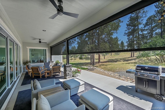 view of patio with ceiling fan and an outdoor living space