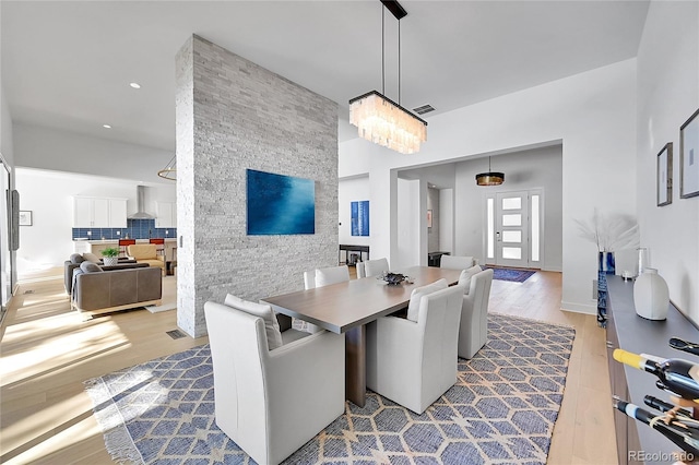 dining room featuring wood finished floors and recessed lighting