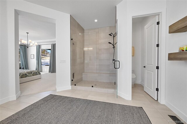 bathroom with tile patterned floors, a stall shower, baseboards, a chandelier, and recessed lighting