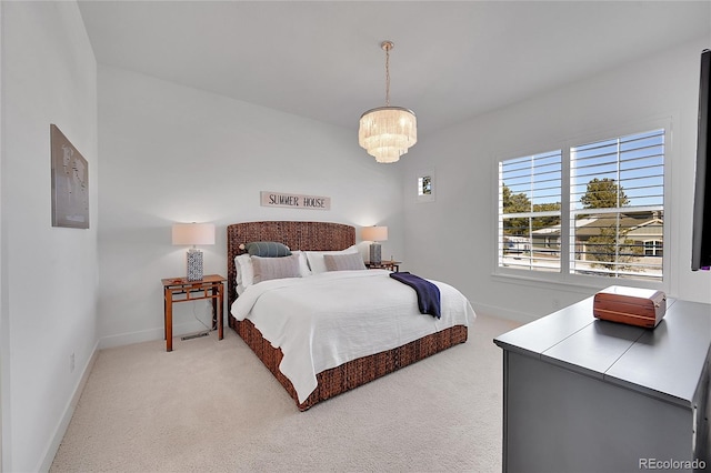 bedroom with light carpet, baseboards, and a chandelier