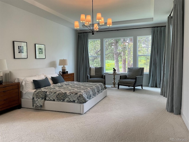 9228 Lone Timber Ct, Parker, CO 80134 - bedroom with carpet floors, a chandelier, and a tray ceiling