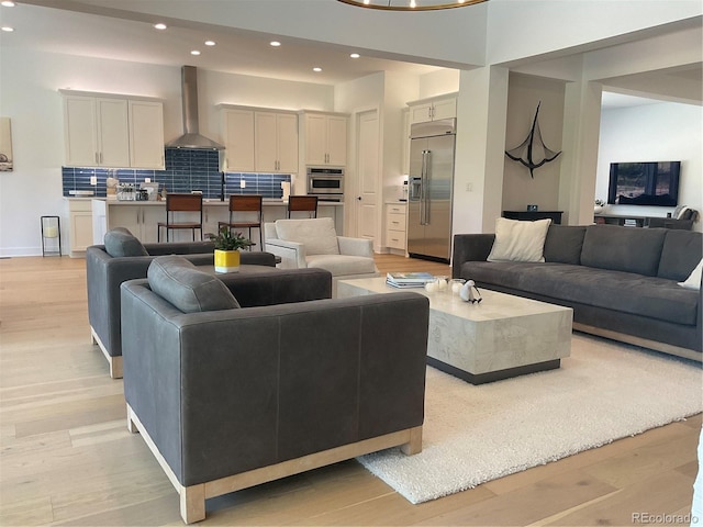 9228 Lone Timber Ct, Parker, CO 80134 - living area featuring light wood-style flooring and recessed lighting