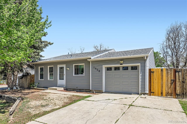 1958 Cathay Ct, Aurora, CO 80011 - ranch-style home featuring driveway, an attached garage, fence, and a shingled roof