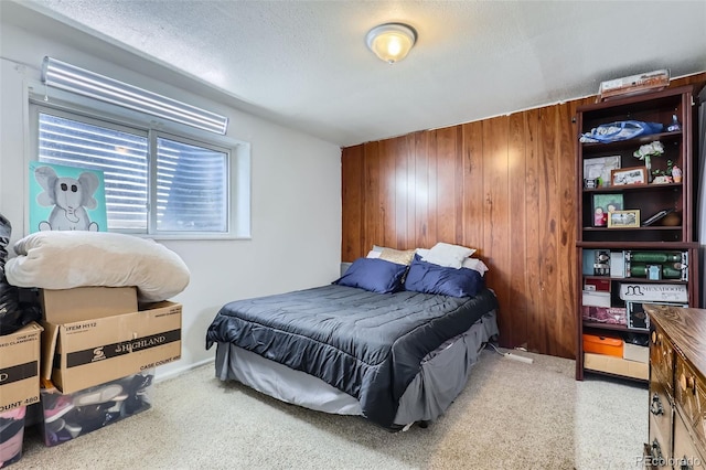1958 Cathay Ct, Aurora, CO 80011 - carpeted bedroom with wood walls and a textured ceiling