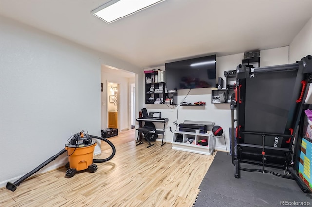 1958 Cathay Ct, Aurora, CO 80011 - exercise room featuring wood finished floors and baseboards