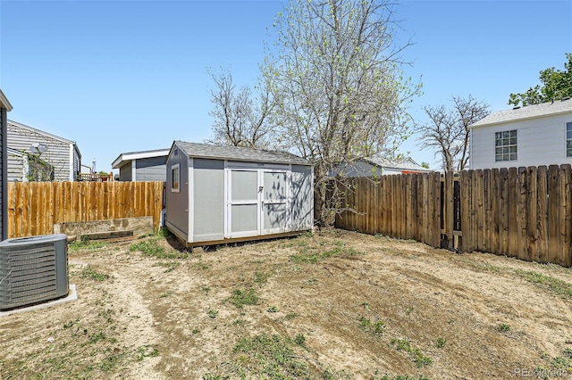 1958 Cathay Ct, Aurora, CO 80011 - fenced backyard with cooling unit, a shed, and an outdoor structure