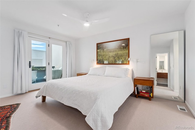 carpeted bedroom with ensuite bath, access to outside, and ceiling fan