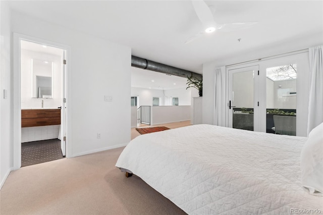 bedroom with carpet and connected bathroom