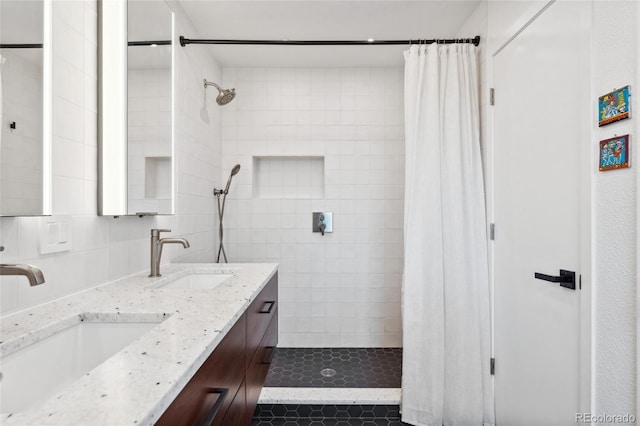 bathroom featuring vanity, a shower with curtain, and decorative backsplash