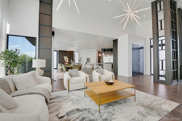 living room with hardwood / wood-style flooring and a chandelier