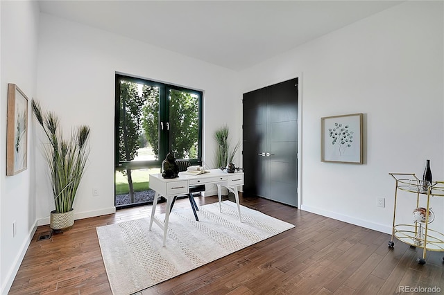 office featuring plenty of natural light and dark wood-type flooring