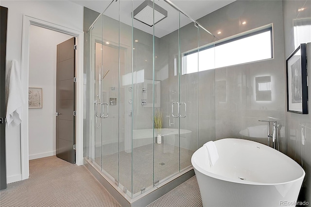 bathroom featuring tile patterned flooring and plus walk in shower