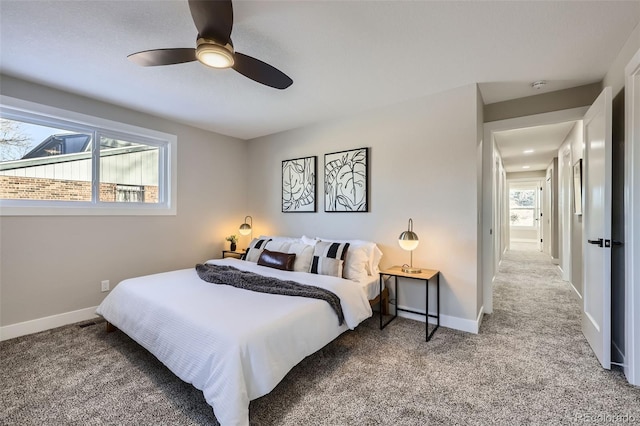 bedroom with ceiling fan and carpet flooring