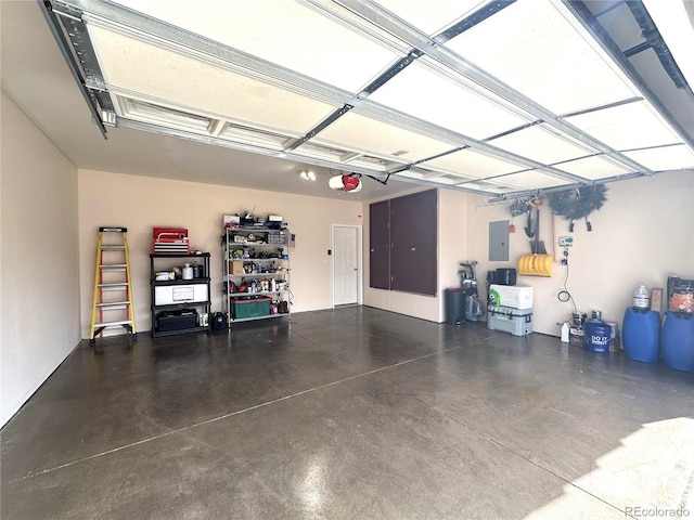 garage featuring a garage door opener and electric panel