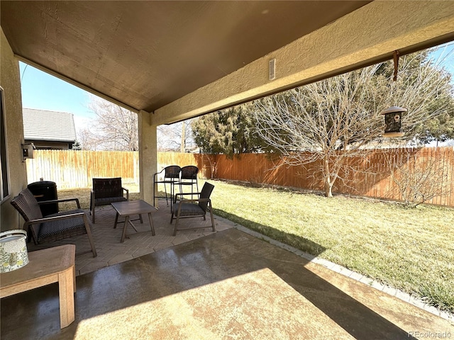view of patio featuring a fenced backyard