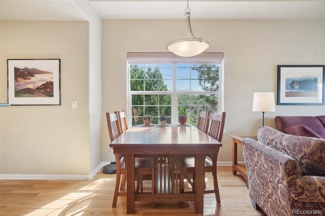 6701 W Yale Ave, Lakewood, CO 80227 - dining room featuring light wood-type flooring and baseboards