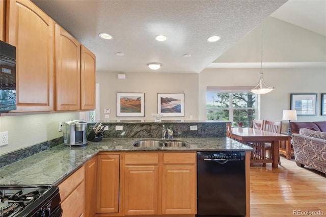 6701 W Yale Ave, Lakewood, CO 80227 - kitchen featuring black appliances, a sink, a peninsula, dark stone countertops, and recessed lighting