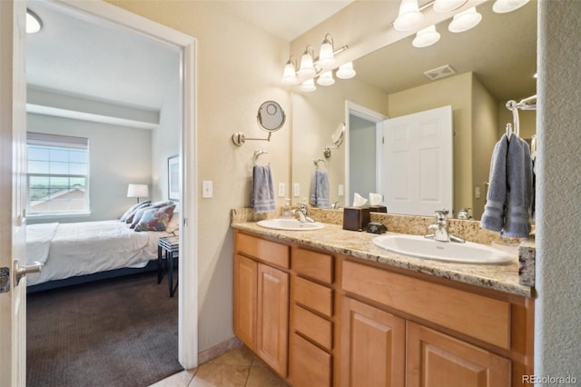 6701 W Yale Ave, Lakewood, CO 80227 - full bath with ensuite bath, tile patterned flooring, and double vanity