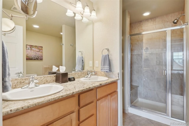 6701 W Yale Ave, Lakewood, CO 80227 - bathroom with a stall shower, tile patterned flooring, double vanity, and recessed lighting
