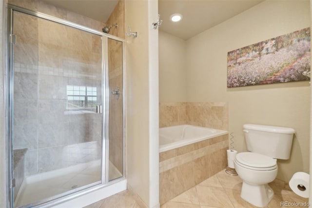 6701 W Yale Ave, Lakewood, CO 80227 - bathroom featuring tile patterned flooring, toilet, a stall shower, and a bath
