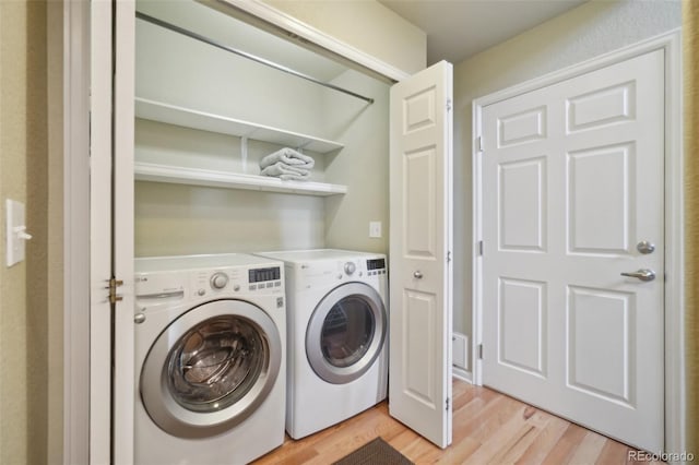 6701 W Yale Ave, Lakewood, CO 80227 - washroom featuring independent washer and dryer and light wood-style floors