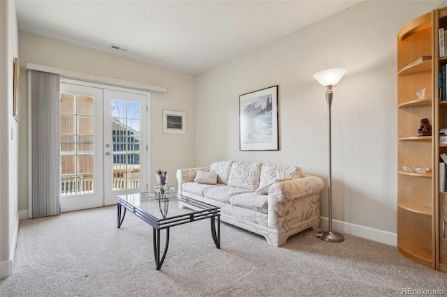 6701 W Yale Ave, Lakewood, CO 80227 - carpeted living room featuring french doors and baseboards