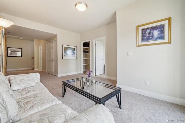 6701 W Yale Ave, Lakewood, CO 80227 - living area featuring carpet flooring, baseboards, and built in features