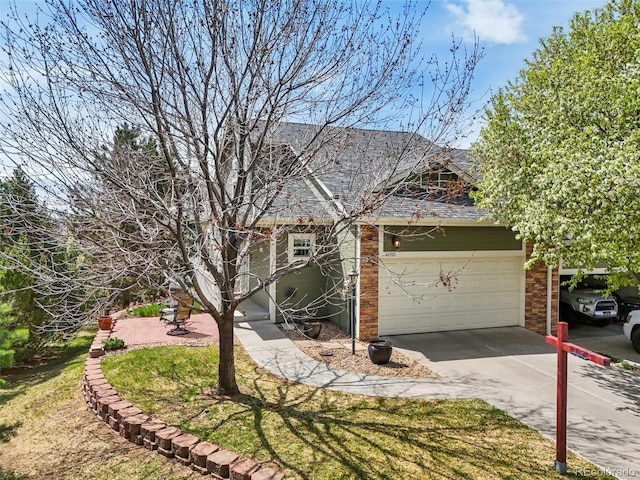 6701 W Yale Ave, Lakewood, CO 80227 - view of front of home with driveway and an attached garage