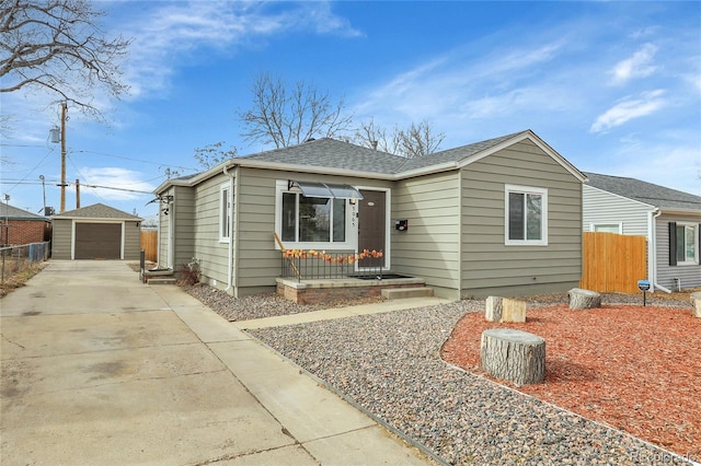 view of front facade featuring an outbuilding and a garage