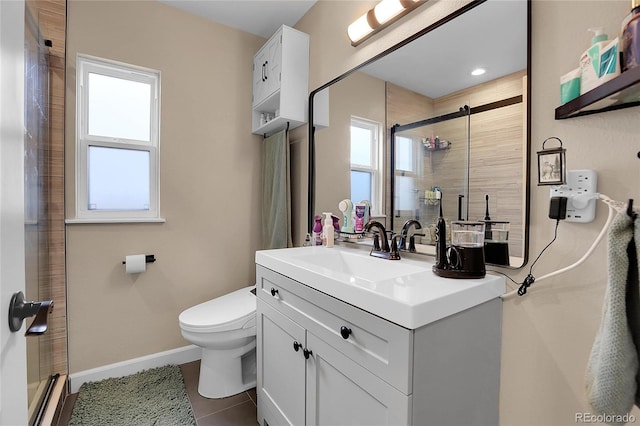 bathroom featuring vanity, an enclosed shower, tile patterned floors, and toilet