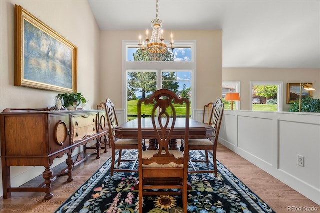10 Oakmont Ln, Littleton, CO 80127 - dining area featuring a chandelier, plenty of natural light, and light wood-style flooring