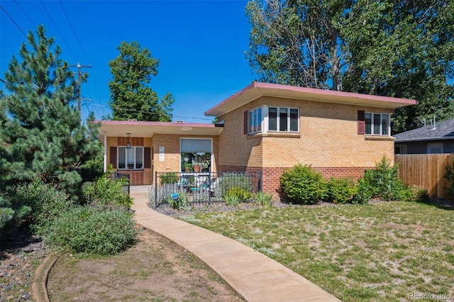 1497 S Garfield St, Denver, CO 80210 - view of front facade featuring brick siding