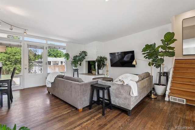 1497 S Garfield St, Denver, CO 80210 - living area featuring wood finished floors and stairway