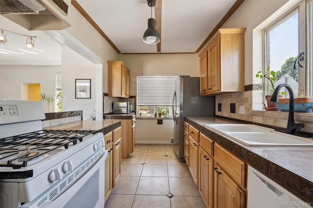 1497 S Garfield St, Denver, CO 80210 - kitchen featuring white appliances, dark countertops, decorative backsplash, light tile patterned flooring, and decorative light fixtures