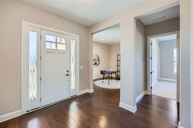 foyer entrance featuring dark hardwood / wood-style floors