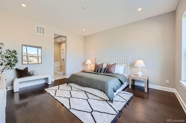 bedroom featuring dark hardwood / wood-style floors and connected bathroom