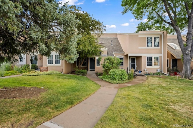 13025 E Bethany Pl, Aurora, CO 80014 - view of front of home featuring stucco siding and a front lawn