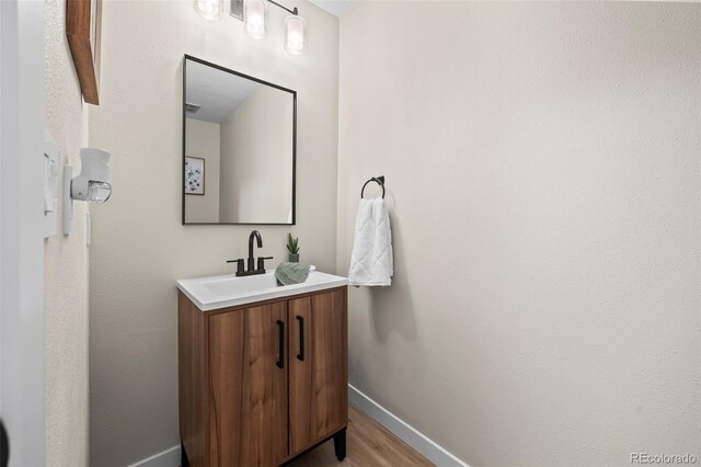 13025 E Bethany Pl, Aurora, CO 80014 - bathroom featuring vanity and wood finished floors