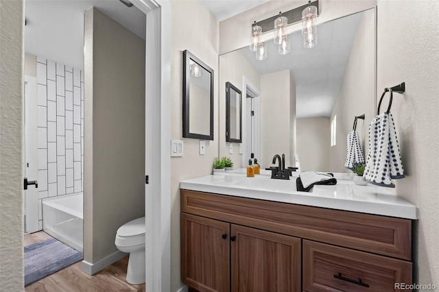 13025 E Bethany Pl, Aurora, CO 80014 - full bathroom featuring vanity, wood finished floors, and washtub / shower combination