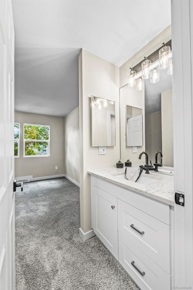 13025 E Bethany Pl, Aurora, CO 80014 - bathroom with vanity and carpet flooring