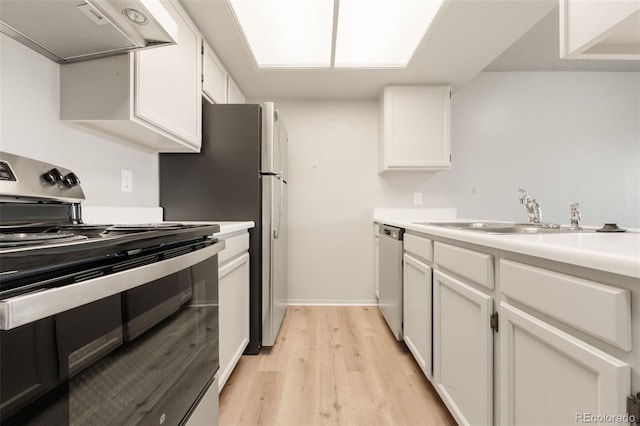 kitchen with white cabinetry, sink, exhaust hood, and appliances with stainless steel finishes