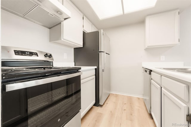 kitchen featuring ventilation hood, sink, appliances with stainless steel finishes, light hardwood / wood-style floors, and white cabinetry