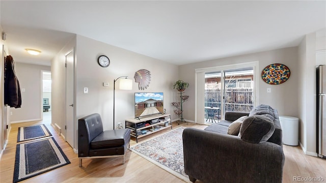 living room with light hardwood / wood-style floors