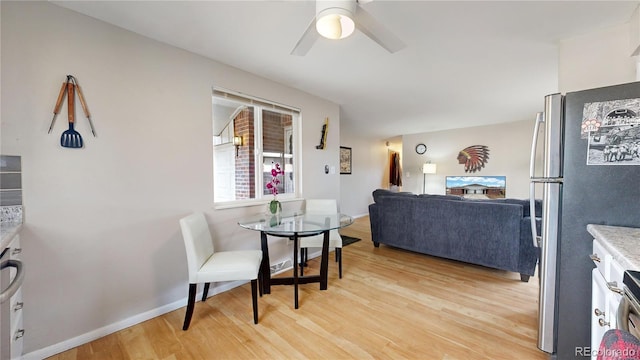 dining room featuring ceiling fan and light hardwood / wood-style floors