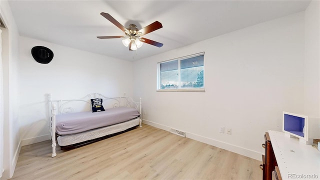 bedroom featuring light wood-type flooring and ceiling fan