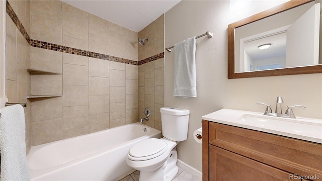 full bathroom featuring tile patterned flooring, vanity, toilet, and tiled shower / bath